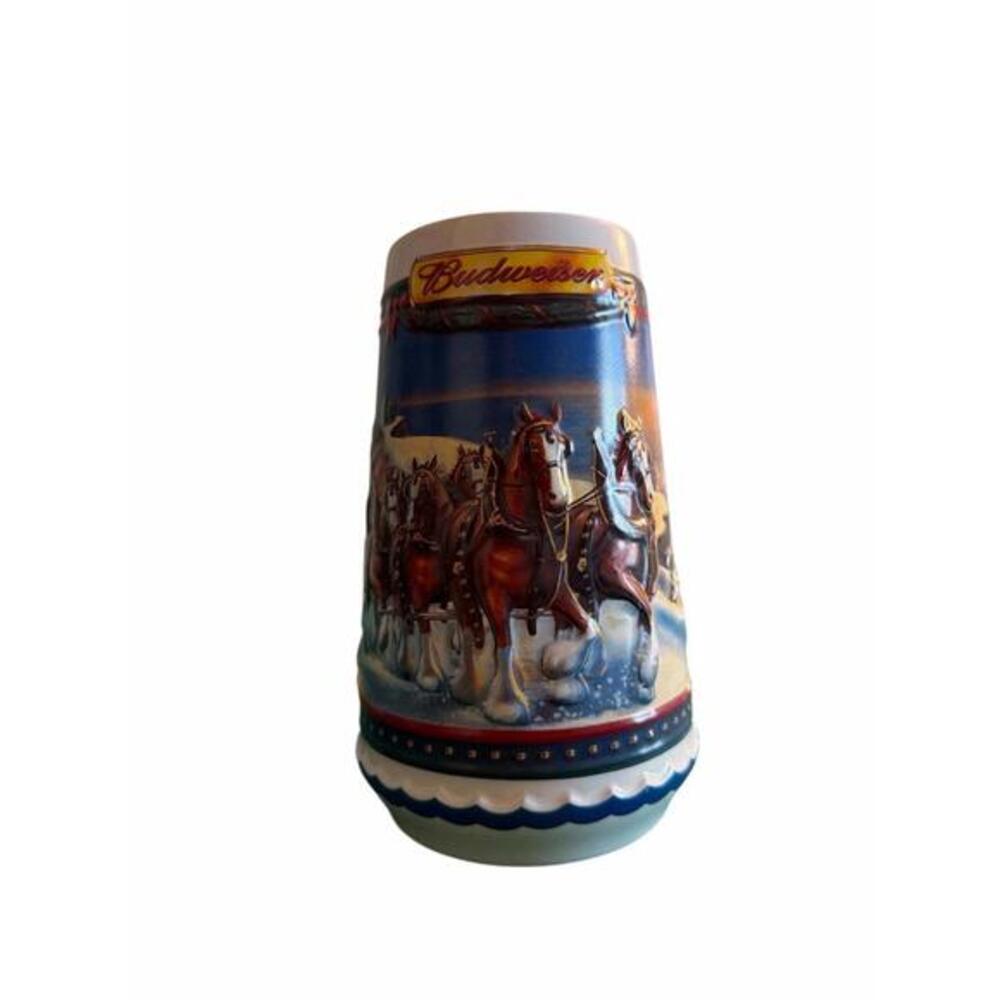 Budweiser stein 2002 Budweiser Holiday Stein, titled "Guiding the Way Home". 
Th